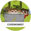 CodeMonkey monkeys sitting behind a laptop with a banana on it in front of a green background