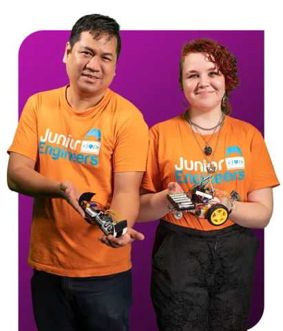 Junior Engineers instructors hold robots from incursion programs
