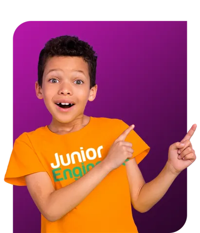 young boy in Junior Engineers shirt pointing