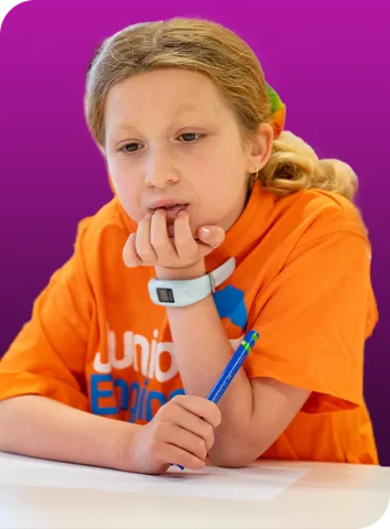 young girl in Junior Engineers shirt learns minitendo